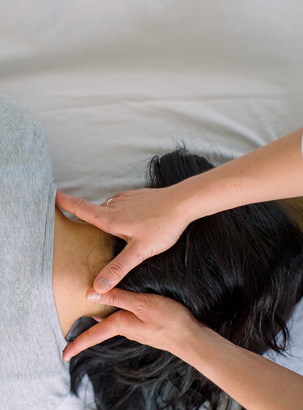 Patient receiving chiropractic care for pain relief at Lombardi Chiropractic in Erie, PA